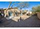 Spacious backyard featuring two houses and a covered patio area at 4031 E Barwick Dr, Cave Creek, AZ 85331