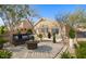 Charming outdoor patio with stylish furniture, lush landscaping, and a cozy lounge area at 4031 E Barwick Dr, Cave Creek, AZ 85331