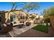 Cozy backyard with patio, turf area, outdoor dining, and privacy fence perfect for entertaining at 4031 E Barwick Dr, Cave Creek, AZ 85331