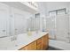 Bathroom with a double sink vanity, a large mirror, and a shower-tub combo at 4031 E Barwick Dr, Cave Creek, AZ 85331