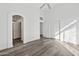 Bright bedroom with luxury vinyl flooring, vaulted ceilings, and closet space at 4031 E Barwick Dr, Cave Creek, AZ 85331