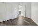 This bedroom includes a closet, wood-look flooring, and white walls at 4031 E Barwick Dr, Cave Creek, AZ 85331