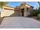 Charming single-story home featuring an attached two-car garage, neutral stucco, and a concrete driveway at 4031 E Barwick Dr, Cave Creek, AZ 85331