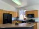 Well-lit kitchen with updated countertops, stainless steel appliances and a breakfast bar for casual dining at 4031 E Barwick Dr, Cave Creek, AZ 85331