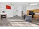 Spacious living room with a fireplace, a bar area, and luxury vinyl flooring at 4031 E Barwick Dr, Cave Creek, AZ 85331
