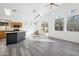 Open-concept living area featuring vaulted ceilings, recessed lights, and luxury vinyl flooring at 4031 E Barwick Dr, Cave Creek, AZ 85331