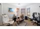 Bright bedroom with three windows, neutral carpet, accent painting, and plenty of natural light at 43261 W Neely Dr, Maricopa, AZ 85138