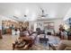 Open-concept living room seamlessly connecting to the kitchen, providing a comfortable and sociable living space at 43261 W Neely Dr, Maricopa, AZ 85138