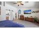 The main bedroom features an ensuite bathroom, a ceiling fan, and carpeted floors at 43261 W Neely Dr, Maricopa, AZ 85138