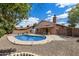 A beautiful backyard with a refreshing swimming pool and covered patio, ideal for outdoor entertaining and relaxation at 450 E Duke Dr, Casa Grande, AZ 85122
