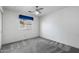 Standard bedroom with a ceiling fan, one window and carpet at 450 E Duke Dr, Casa Grande, AZ 85122