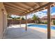 A spacious covered patio overlooking the pool, ideal for outdoor living and entertaining at 450 E Duke Dr, Casa Grande, AZ 85122