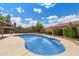 Inviting backyard pool showcasing refreshing blue water, surrounded by a concrete deck perfect for lounging at 450 E Duke Dr, Casa Grande, AZ 85122
