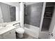 Bathroom with tub and shower combination with gray subway tile at 5013 E Shomi St, Phoenix, AZ 85044