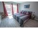 Comfortable bedroom with sliding glass doors leading to the outdoor patio at 5013 E Shomi St, Phoenix, AZ 85044