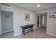Inviting entryway with wood-look tile flooring, neutral walls, and decorative accents creates a warm welcome at 5013 E Shomi St, Phoenix, AZ 85044