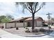Well-maintained single story home with a two-car garage and low-maintenance desert landscaping on a corner lot at 5013 E Shomi St, Phoenix, AZ 85044