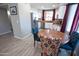 Bright kitchen featuring stainless steel appliances and a dining area with stylish, colorful chairs at 5013 E Shomi St, Phoenix, AZ 85044