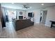 Spacious living room featuring tile floors, a cozy fireplace, and an abundance of natural light at 5013 E Shomi St, Phoenix, AZ 85044