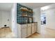 Hallway features built in shelves and cabinets, with sight lines to the kitchen and entry door at 614 W Kings Ave, Phoenix, AZ 85023
