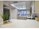 Bright and airy kitchen with stainless steel appliances, white cabinetry, and a large window above the sink at 614 W Kings Ave, Phoenix, AZ 85023