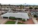 Aerial view of a single-Gathering home with well-maintained front yard and mature trees at 6207 W Orange Dr, Glendale, AZ 85301