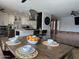 Open concept dining area with a large wooden table and an inviting atmosphere at 6207 W Orange Dr, Glendale, AZ 85301