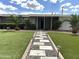 Charming home featuring a lovely landscaped front yard and inviting walkway at 6207 W Orange Dr, Glendale, AZ 85301
