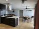 Bright kitchen and dining area with island, stainless steel appliances, and decorative details at 6207 W Orange Dr, Glendale, AZ 85301