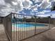 Fenced pool area with lounge chairs offers a private space for relaxation and outdoor recreation at 6207 W Orange Dr, Glendale, AZ 85301