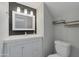 Stylish bathroom with a vanity, modern mirror, and decorative shelving; toilet included at 860 N Mcqueen Rd # 1184, Chandler, AZ 85225