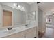 Bathroom with double sinks, modern fixtures, vanity and ample storage, plus a view of the patio at 860 N Mcqueen Rd # 1184, Chandler, AZ 85225