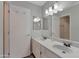 Bathroom featuring double sinks, modern fixtures, and vanity with ample storage at 860 N Mcqueen Rd # 1184, Chandler, AZ 85225