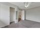 Neutral-toned bedroom features a ceiling fan, closet and open doorway for great flow at 860 N Mcqueen Rd # 1184, Chandler, AZ 85225