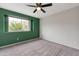 The bedroom features a ceiling fan, closet, and accent wall with a window view at 860 N Mcqueen Rd # 1184, Chandler, AZ 85225