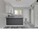 Modern kitchen with gray countertops, white cabinets, and stainless steel appliances at 860 N Mcqueen Rd # 1184, Chandler, AZ 85225