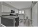 Modern kitchen with gray countertops, white cabinets, and stainless steel appliances at 860 N Mcqueen Rd # 1184, Chandler, AZ 85225