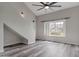 Spacious living room features stylish flooring, a large window, and a modern ceiling fan at 860 N Mcqueen Rd # 1184, Chandler, AZ 85225