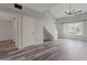 Spacious living room with high ceilings, gray plank flooring, and natural light at 860 N Mcqueen Rd # 1184, Chandler, AZ 85225