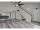 Inviting living space with open kitchen, stairs, and stylish plank flooring at 860 N Mcqueen Rd # 1184, Chandler, AZ 85225