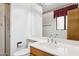 Bathroom features a vanity with a white sink, toilet, a large mirror, and a walk-in shower at 8629 E Cambridge Ave, Scottsdale, AZ 85257