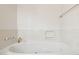Clean white bathtub with jacuzzi jets and chrome fixtures, creating a bright and relaxing atmosphere at 8629 E Cambridge Ave, Scottsdale, AZ 85257