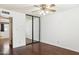 Bedroom with hardwood flooring and a sliding mirror closet and plenty of natural light at 8629 E Cambridge Ave, Scottsdale, AZ 85257