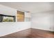 Spacious bedroom offers hardwood floors and bright natural light from a large picture window at 8629 E Cambridge Ave, Scottsdale, AZ 85257