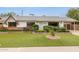 Charming single-story home with a well-manicured front yard and attractive landscaping features at 8629 E Cambridge Ave, Scottsdale, AZ 85257