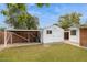 White backyard shed with an awning that provides space for storage and covered parking at 8629 E Cambridge Ave, Scottsdale, AZ 85257