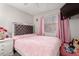 Cozy bedroom with a plush bed, decorative accents, and a relaxing ambiance at 8741 W Manzanita Dr, Peoria, AZ 85345