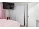 Bedroom featuring soft carpet, a window for natural light, and sliding closet doors at 8741 W Manzanita Dr, Peoria, AZ 85345