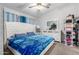 Comfortable bedroom with a decorative headboard, soft bedding, and ample storage space at 8741 W Manzanita Dr, Peoria, AZ 85345