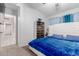 Comfortable bedroom with a decorative headboard, soft bedding, and easy access to walk-in closet and en suite bathroom at 8741 W Manzanita Dr, Peoria, AZ 85345